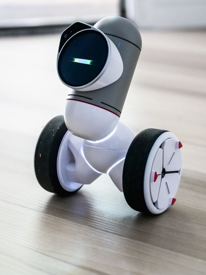 why-choose-us Close-up of a modern robotic device with wheels, showcasing advanced technology.